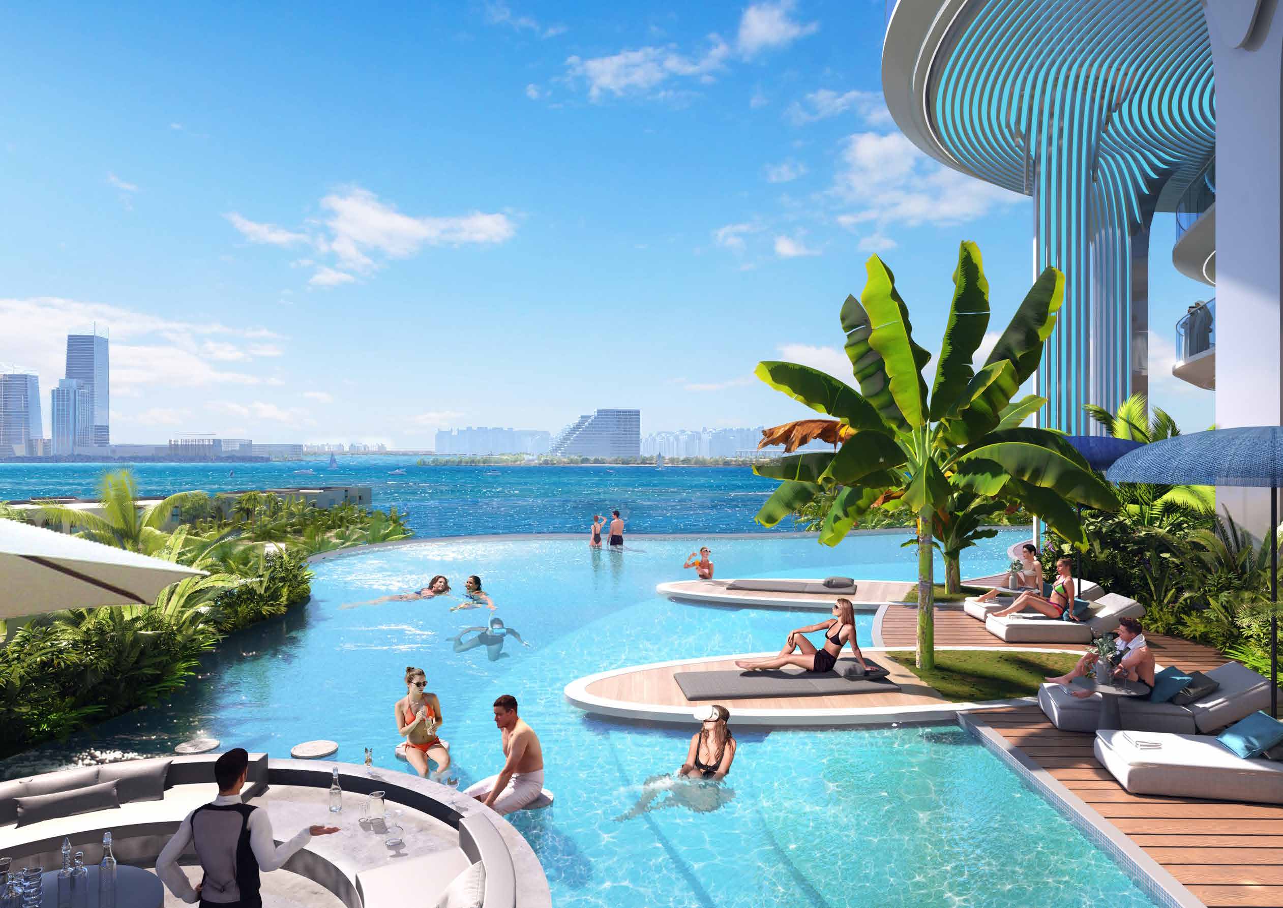 Infinity pool with sun loungers and palms, the sea and skyline beyond