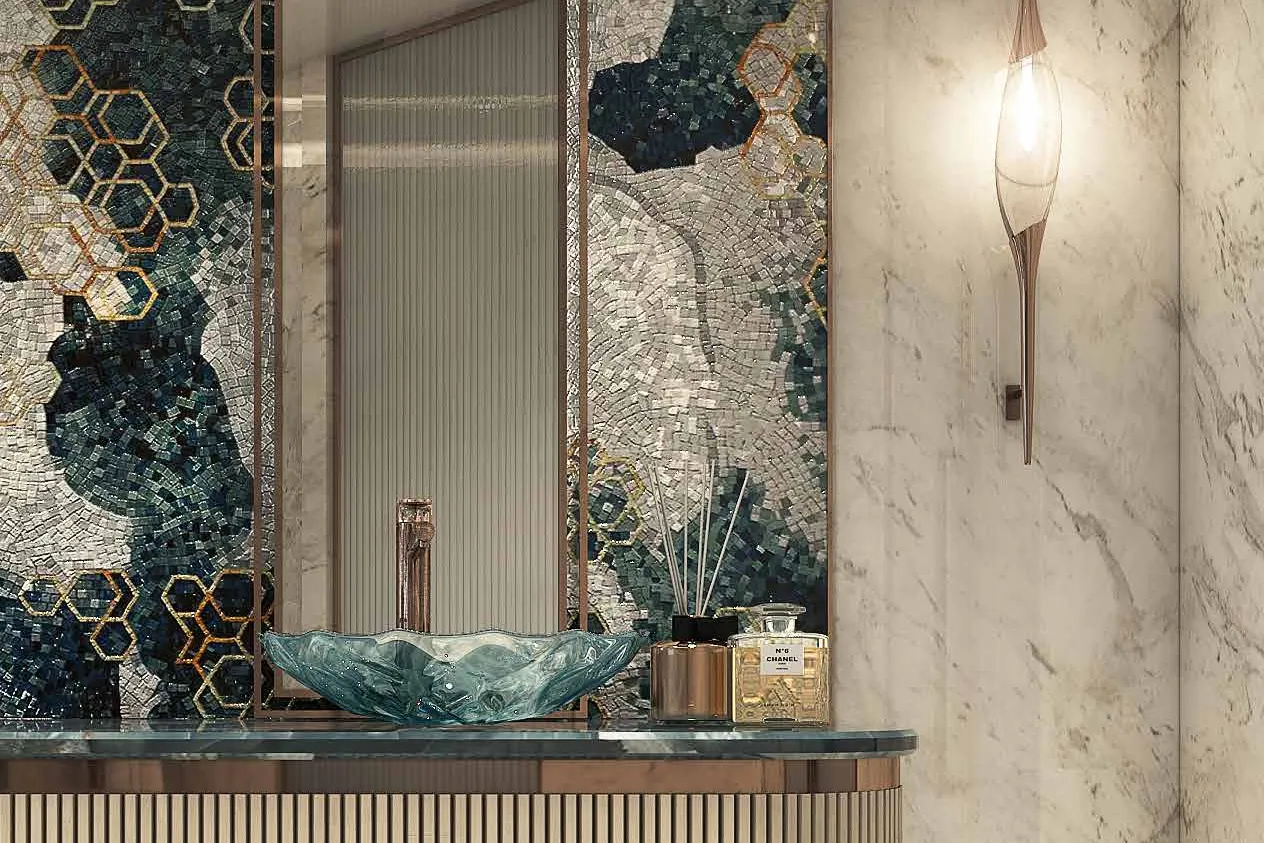 Washbasin with green mosaic wall and tall arched mirror